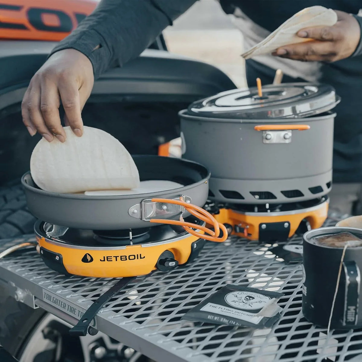 Backpack camping cooking equipment system, including camping cookware, suitable for backpacking and camping use.